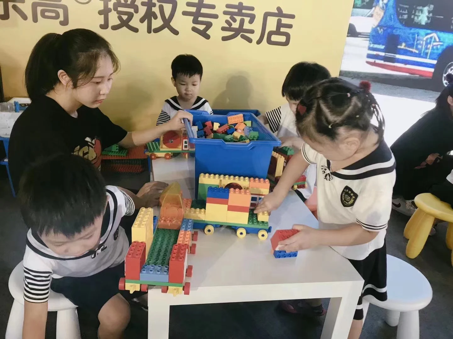 Family building activity in an automotive setting · Historical photograph