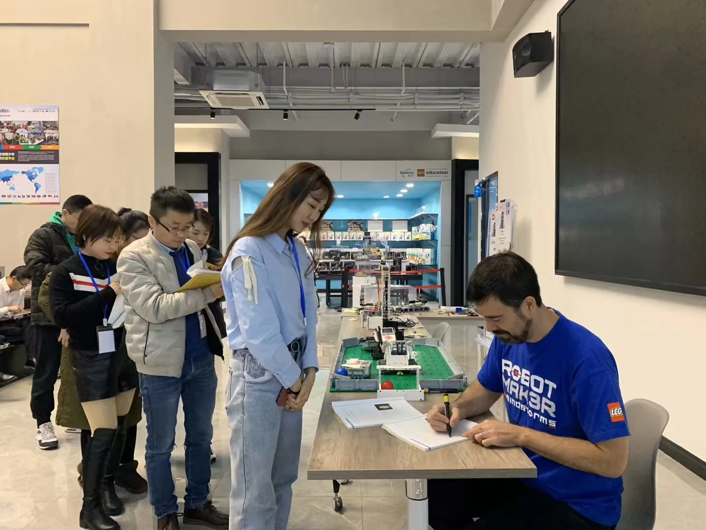 An educator joins the robot demonstration
